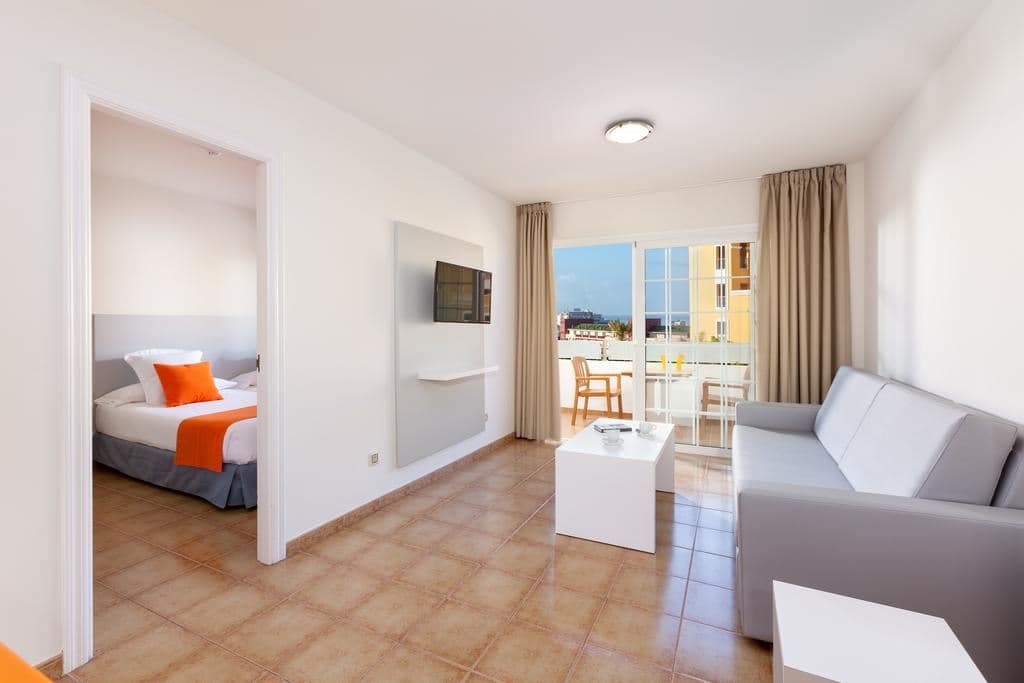rooms-family-room-pool-view-or-partial-pool-view--one-bedroom-with-balcony-or-terrace