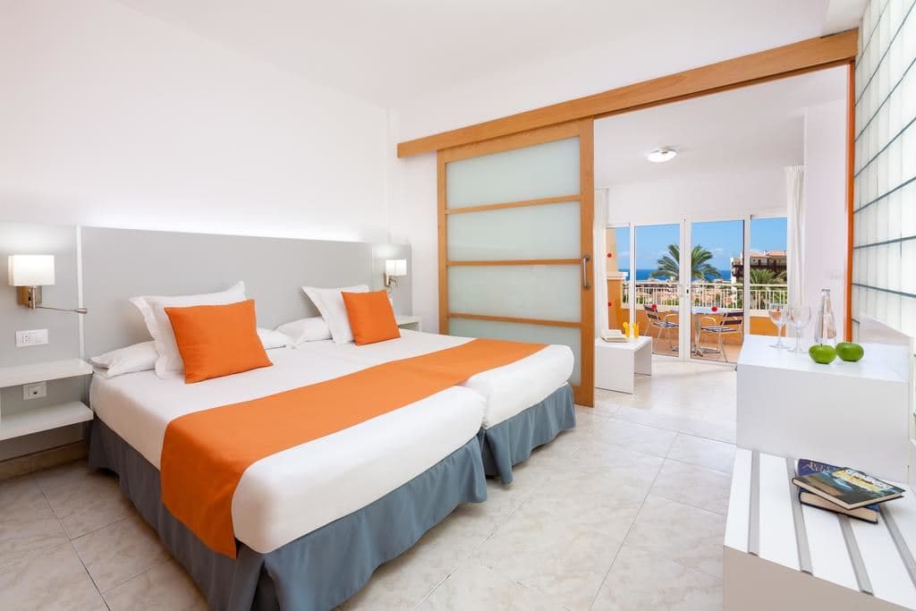 rooms-family-room-pool-view-or-partial-pool-view--one-bedroom-with-balcony-or-terrace